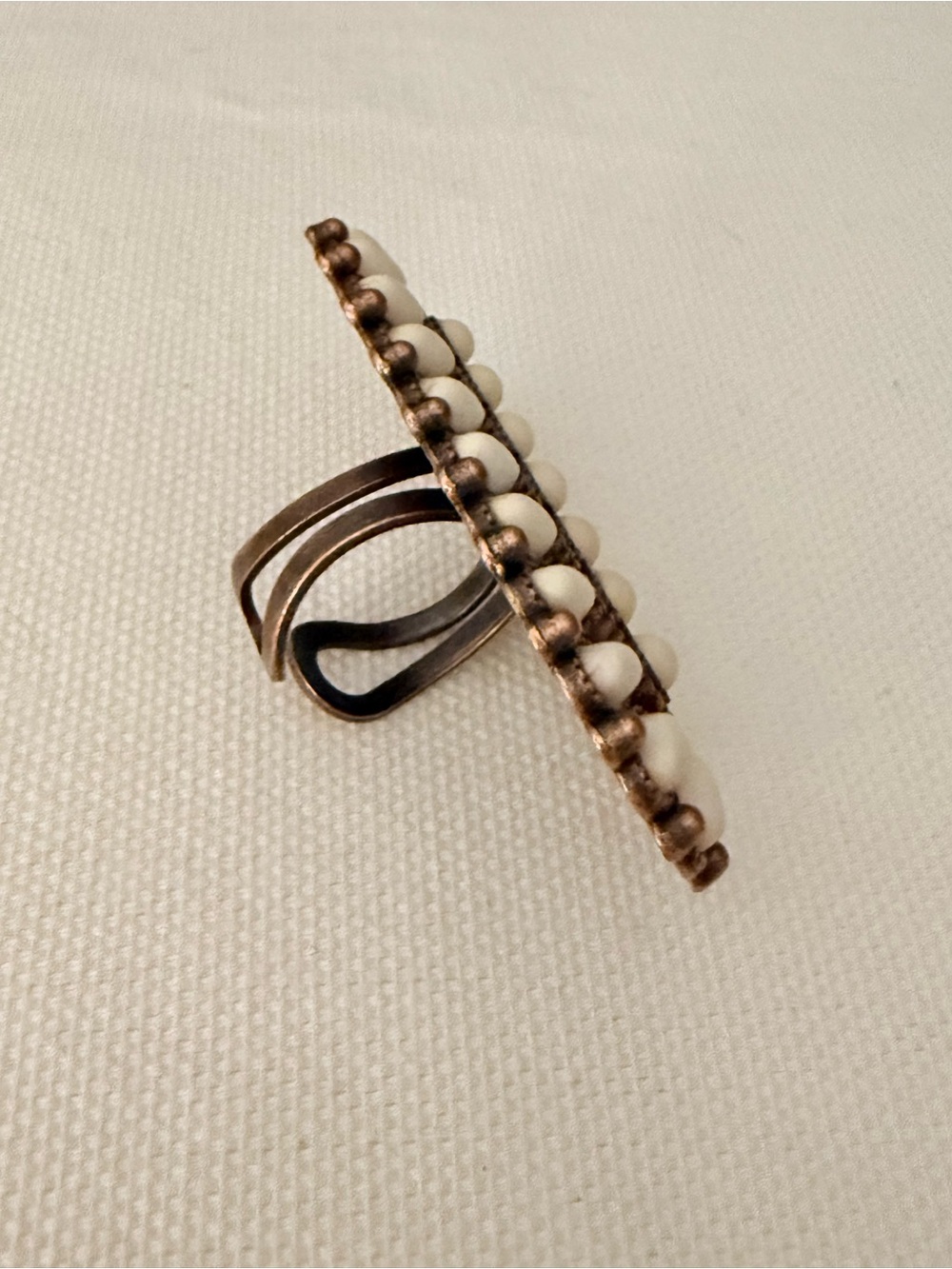 White Bead Bar Ring with Antiqued Gold-Tone Setting